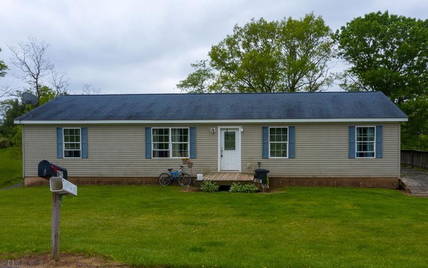 1 story home on approx. 2 Acres of land! This home features 4 bedrooms and 2 bathrooms. Enjoy the convenience of an eat in kitchen just off the living room. Through the kitchen is a deck that overlooks the private property. Downstairs you can find a full sized basement with high ceilings and endless opportunities. With some TLC, you can make this home yours!