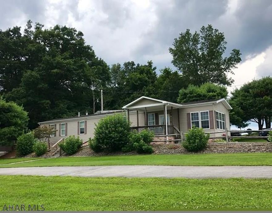 Absolutely gorgeous setting with beautiful views. 16.2 Acres tillable is rented for corn crop this year. Huge 20 x 40 garage has large eat-in kitchen and lots of 3 sheds. Mobile home has large eat-in kitchen and lots of natural light. All appliances included. Porches and decks surround to enjoy angle of beautiful views of fields and woods.