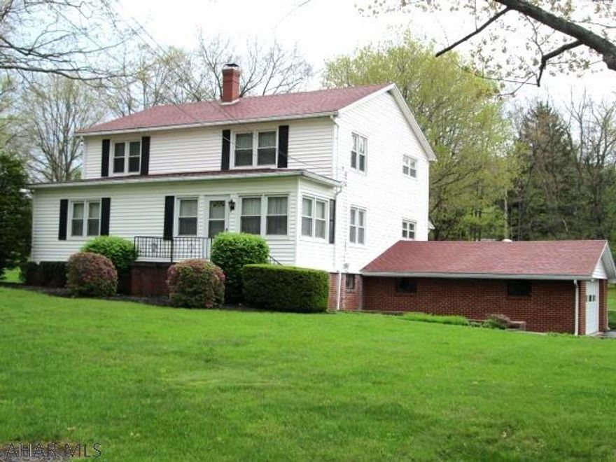 Logan Twp/Altoona Penn State area. Currently used as a multi family. First floor has 3 bedrooms & bath and the second floor apartment features 2 bedrooms & bath. The property consists of 2 acres.  Integral 2 car garage and separate pole barn garage. Utilities are separate.