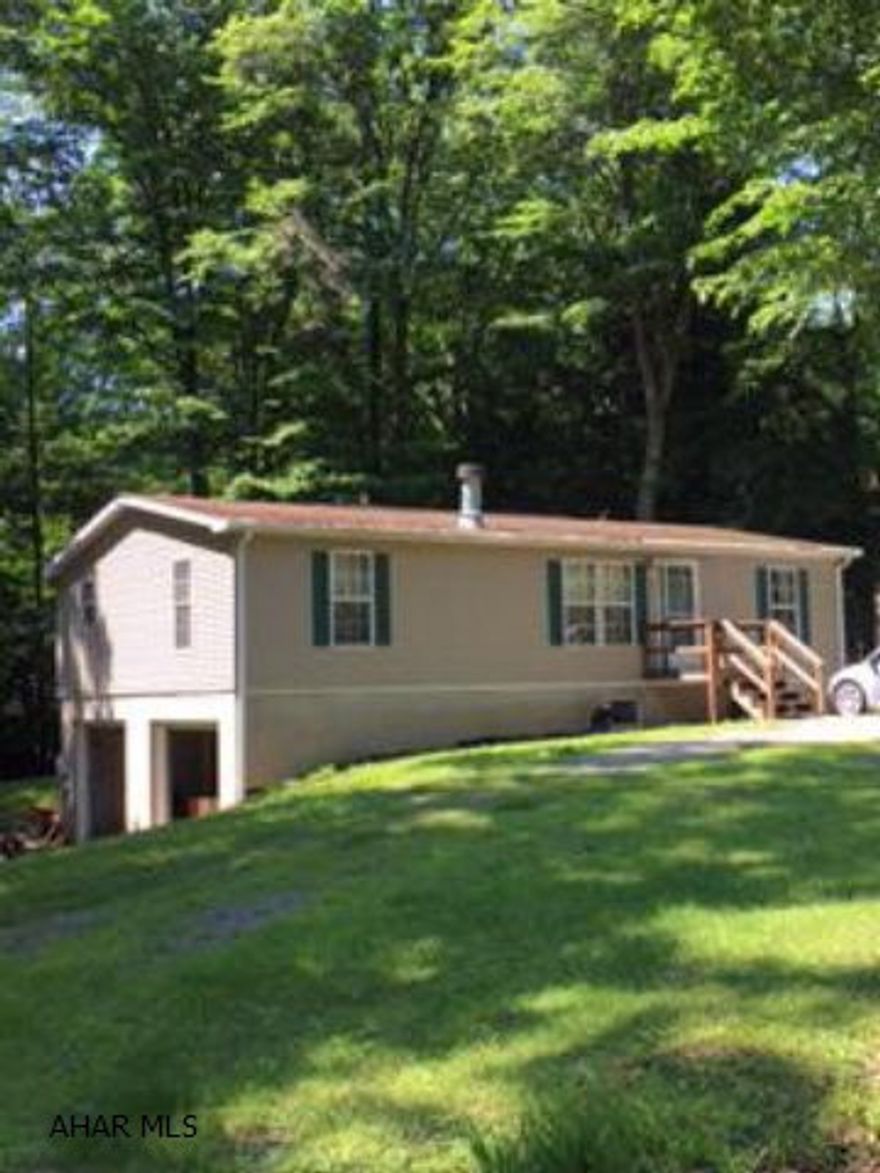 This is a great starter or perfect for downsizing. Open floor plan, rear deck offers a nice serene setting. Needs some love, but loads of possibilities. This is a doublewide.