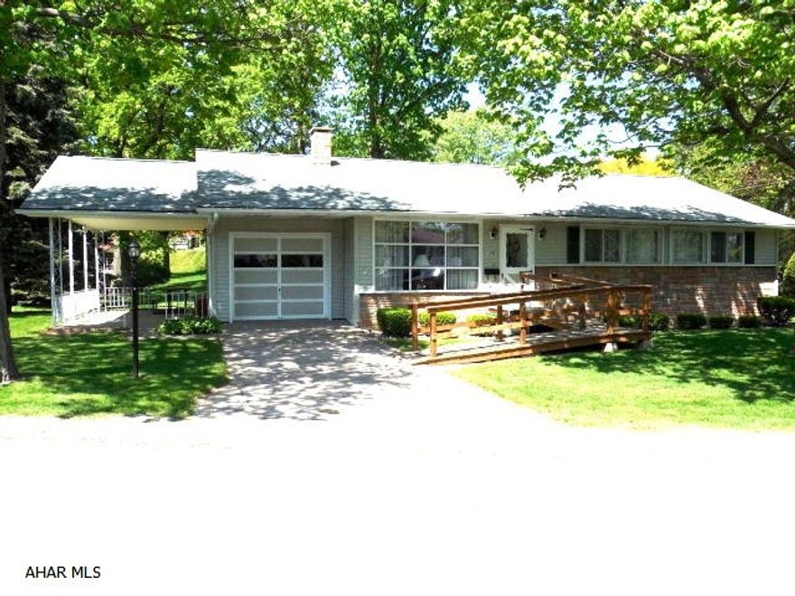 Immaculate rancher with 3 bedrooms, l bath, l car attached garage. Newer furnace, central air and hot water tank approx. year old. Large side  concrete porch with roof. Full basement. House sits on 100x110 lot but also included is a  58x85 lot across the street.Taxes on lot approx. $450.00