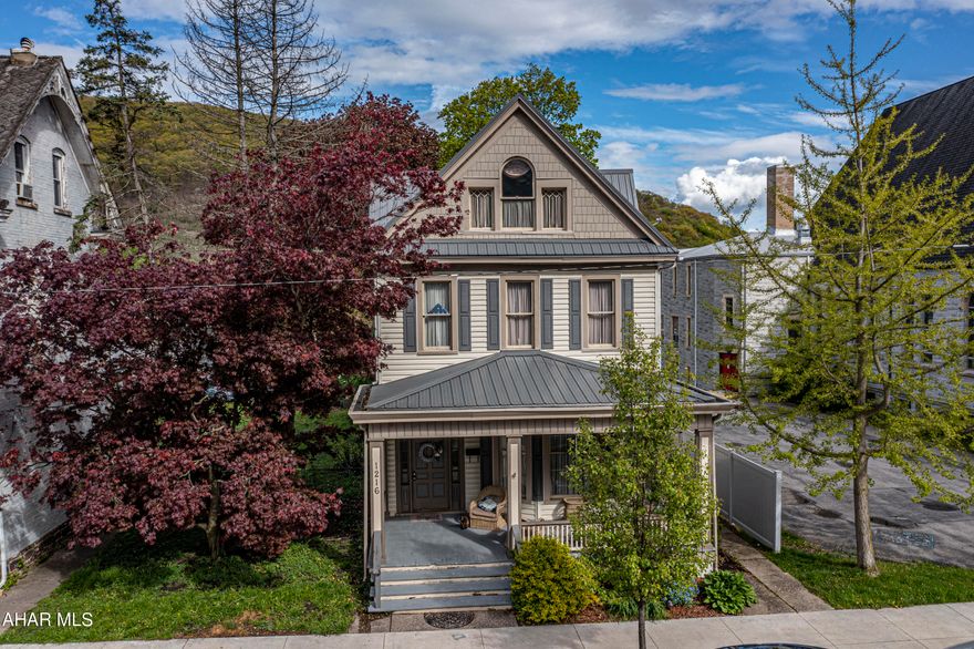 Stunning 2 story home in the Tyrone Borough. This home boasts a grand entrance . Step into a large foyer, open living room and dining room and nice kitchen with a breakfast nook and half bath. Upstairs are 4 bedrooms a full bath and bonus room. Two stair cases lead to the upstairs. High ceilings, crown molding and hardwood floors are just some of the charms of this home. Check out the Matter port tour.