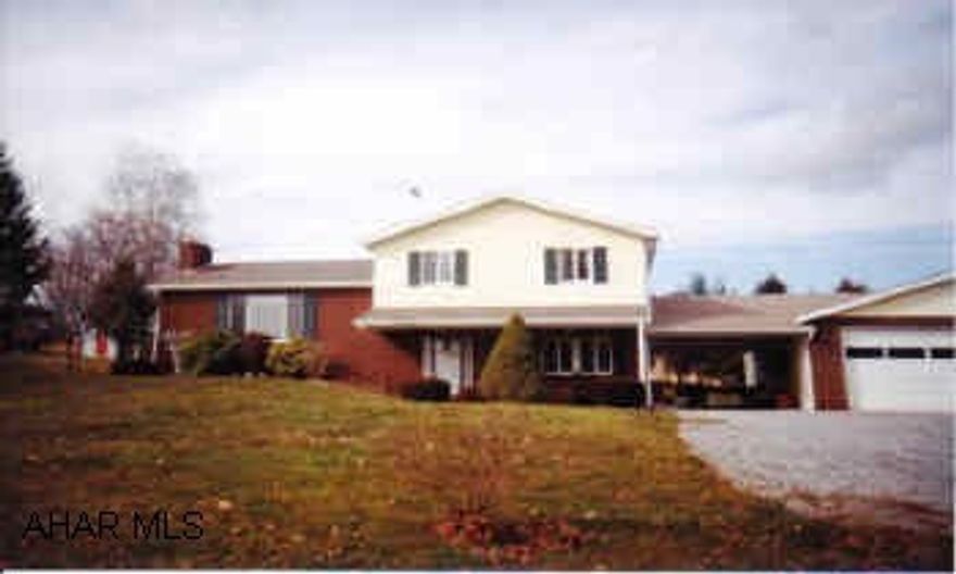 Spacious multi-level home with 2 car oversized garage and utility garage on almost an acre.