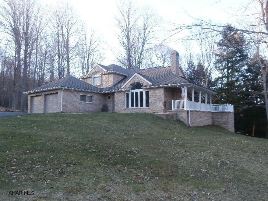 Fabulous brick 1.5 story home with attached garage. Three Bedrooms, three baths, quality throughout.  Basement garage for mowers ect plus a two car attached garage, paved drive - too much to list! A truly solid home at a great price. Deed restricted to homesite.