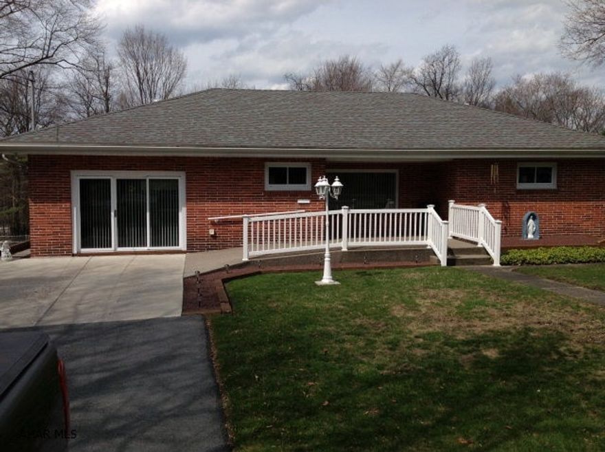 Cresson Twp. 3 bedroom brick ranch on a large level fenced yard.