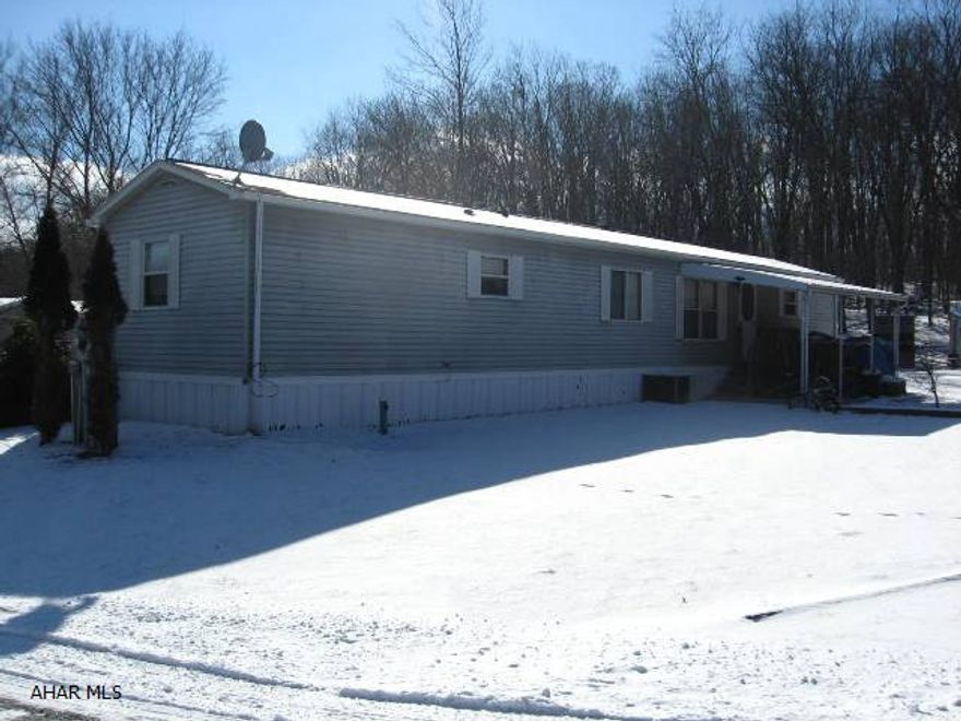 Take a look at this 2 bedroom, 1 bath mobile home that's located on the outer edge of Wood on .445 of an acre and includes central air, wood stove, garage, sheds and nice yard.