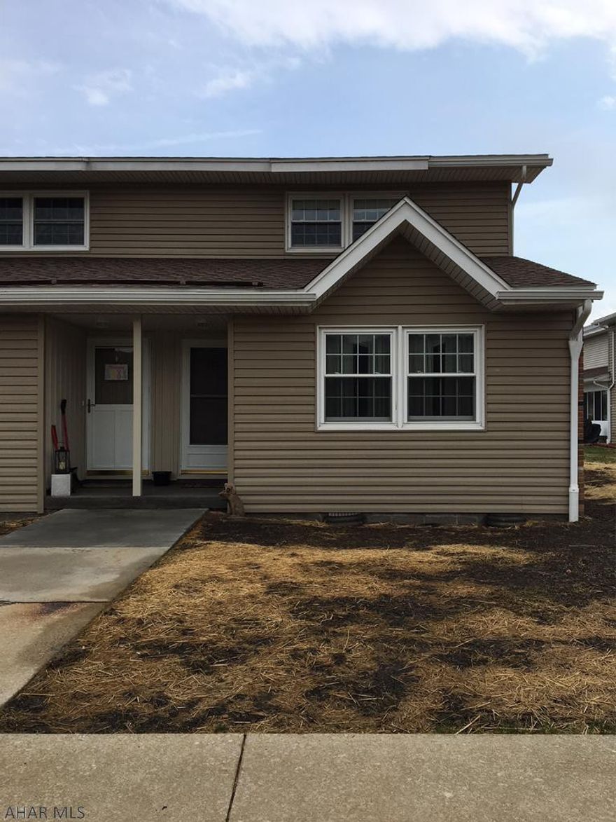 Nice end unit. Just painted top to bottom. Newer windows and sliding glass door with blinds. Vaulted ceiling in living room. Carpet just cleaned. Enjoy maintenance free living.  HOA fees of $210.00 monthly include water, sewer, trash, snow removal, lawn care and exterior maintenance. Flood insurance required.