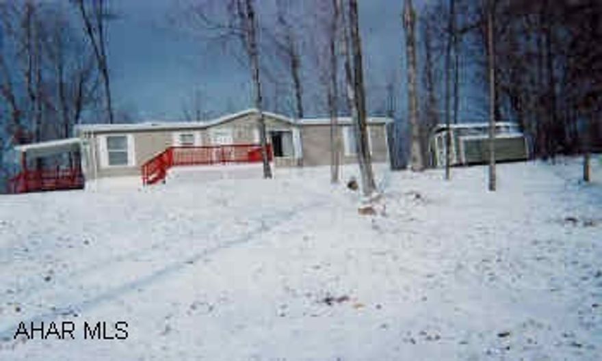 Immaculate doublewide on 1.4 acres, quiet country setting, wooded. Large kitchen, fireplace, skylights, sunken gub, Esh's shed, deck.