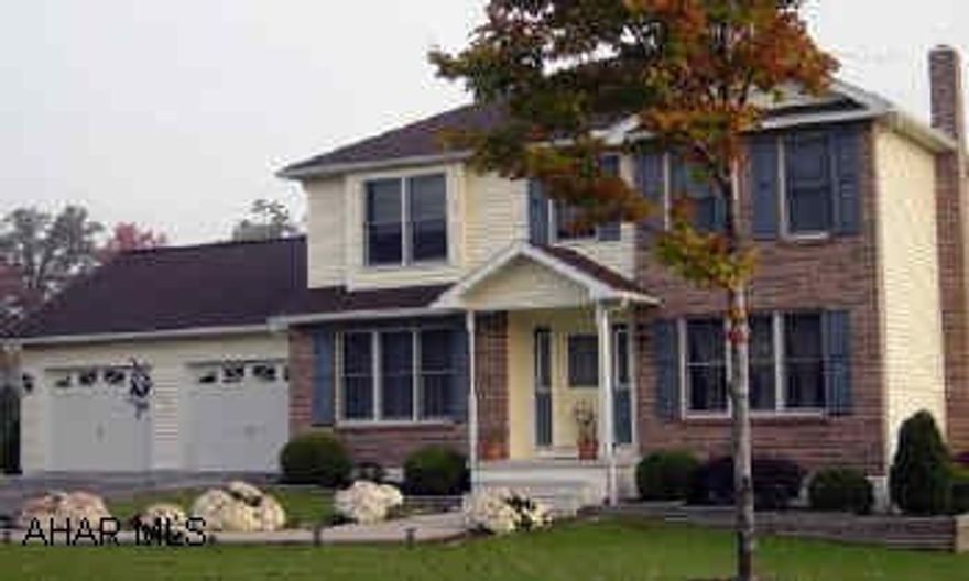 Master bath with whirlpool tub, eat-in kitchen, 1st floor laundry, extra storage above garage, new carpet to be installed in LR.  Lot size:  200.11/88.77/39.77/47.68x128.47/127.71.