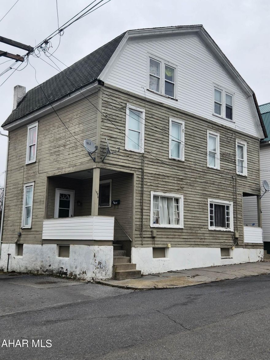 Two-unit duplex one side rented $450/month. Tenant paying $450/month pays all utilities.  This property is a 2 - 2 bedrooms units. There is a room that could be finished in the attic for a 3 bedroom. Natural gas, electric,  water, and sewer are separate with laundry in the basement.  The renter's certificate is current. The exterior will either need to be painted or sided per the city. The property is being sold in As-is condition. Call listing agent for more information.