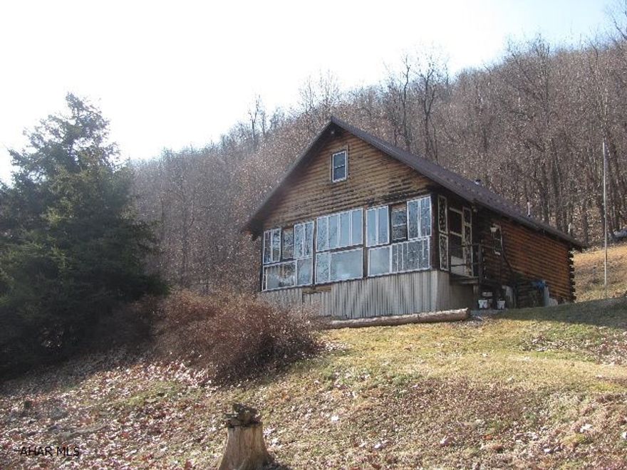 Mountain get-away with open floor plan situated on 107 picturesque acres. Enjoy the seclusion of this log home while still enjoying easy access to Shawnee State Park, State Forests (4 within 17 miles), hiking trails, rail trails, and Flight 93 Memorial. Plenty of wildlife for the avid hunter include bobcat, deer, turkey and black bear. Future potential exploration of Marcellus Shale and mixed hard woods add to the value of this property.