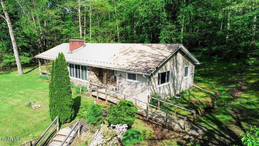 Sitting on nearly 2 acres, one story living, a large 24x7 coved deck. 3 bedrooms, 1 bath