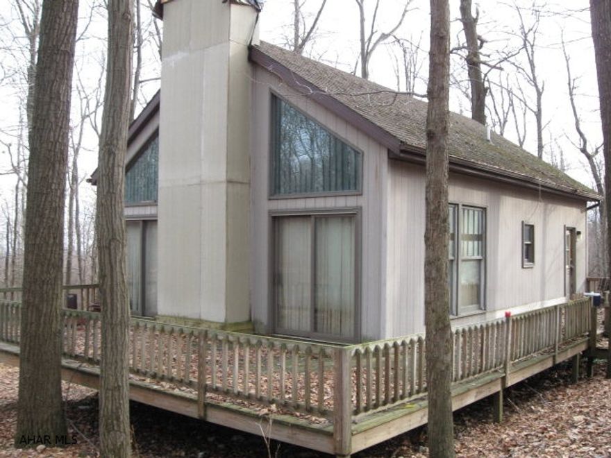 Investors and Handyman - 2 bed 1.5 bath A frame located on .6 Ac wooded lot in Blue Knob Ski Resort.Walk to 9 hole golf course, pool, hot tub, tennis courts that are available for membership fee as well as ski slopes and tubing. Near State Game Lands. House in need of much repair, maintenance and all cosmetics, and will NOT qualify for mortgage.  $150 a year HOA fee covers road maintenance.