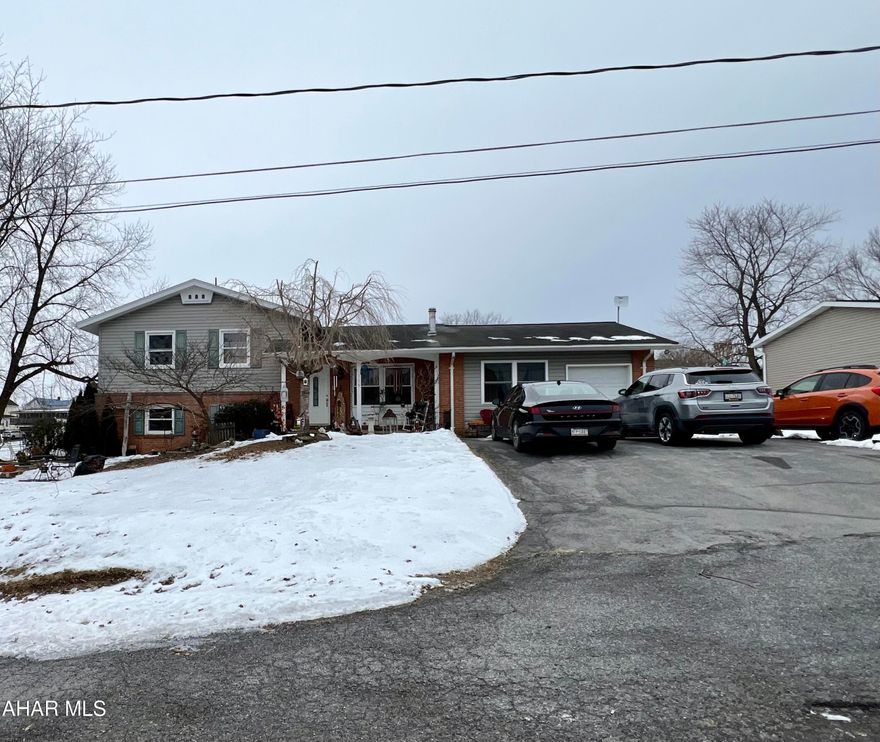 This beautiful 4-5-bedroom house is located on a quiet street in Martinsburg, Pennsylvania. The house features 2.5 bathrooms, an updated kitchen with a large island and walk in pantry. An open concept living room that is perfect for entertaining guests. The house also has a sunroom, an extra room with a stone fireplace. Spacious laundry room on the lower level. The private fenced-in backyard is perfect for outdoor activities and features a sparkling pool that is perfect for hot summer days.   Don't miss out on this amazing opportunity to own a beautiful home in Martinsburg!