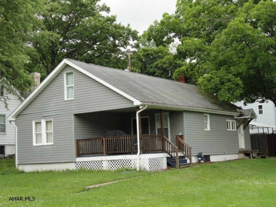 Quaint 1 1/2 story on 4 city lots (.27 acre). 2 - 3 bedrooms and 1 full bath w/laundry hookups. Newly carpeted and painted. Living room w/cathedral ceiling and large eat in kitchen w/new appliances. 2 bedrooms on 1st floor, loft on 2nd floor can be used as bedroom/den. Rural living but convenient to town. Very private w/patio, city owns to the right and across the street, used as park.