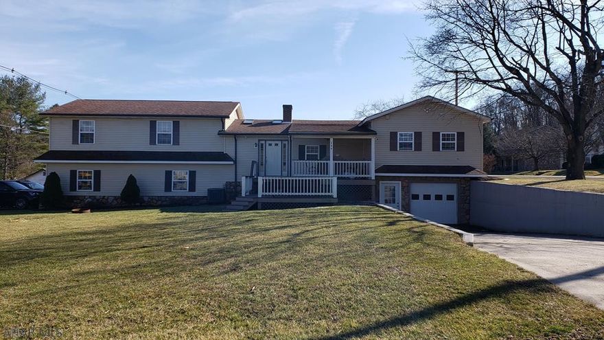 Large 3 bedroom 2 bath home in Williamsburg school district. This home has been remodeled from top to bottom and is move in ready. The first floor is perfect for entertaining with a newly updated kitchen and bathroom.  The large family room has beautiful  woodwork with a stone fireplace, bar and 3/4 bath. For anyone who enjoys cars or hobbies, the 3 garage bays are exceptional.  One garage bay has a full service pit.  For more information on this home or to schedule your private showing, contact listing agent.