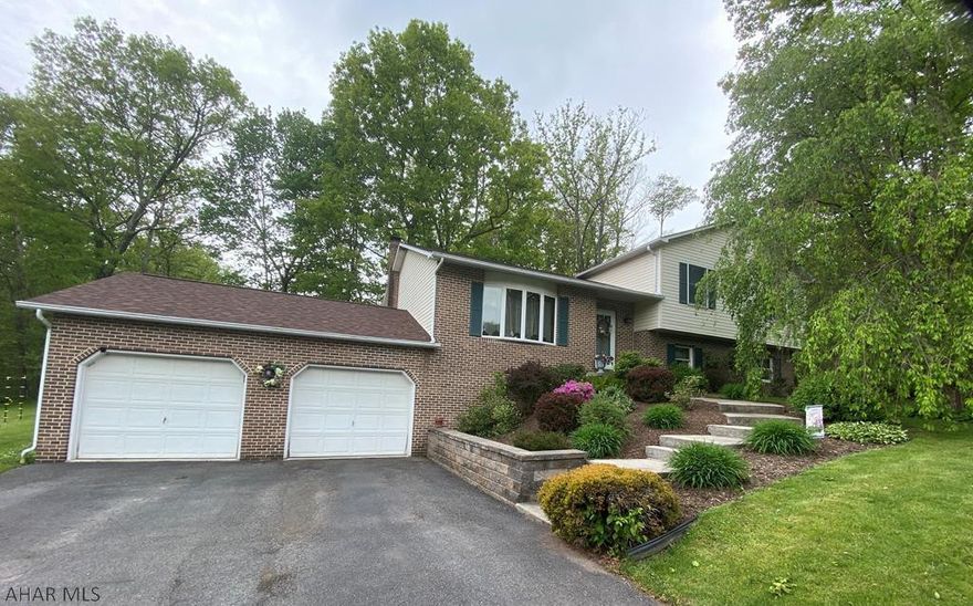 Tucked away in the hills, is this Carson Valley split level home sitting on 1 flat acre lot. If you are searching for a peaceful and quiet area to call home...this is it!  Make memories in the heart of the home...the kitchen. Prepare family meals in the updated oak kitchen that is open concept to the dining room. Step outside onto the deck and enjoy the beautifully maintained yard, private patio with stamped concrete and hot tub. 4 bedrooms and 2.5 baths. Entertain in the spacious lower level family room with a propane fireplace. There is an alternate wood burning fireplace, for an additional, and less expensive heating option. This property is immaculate, well-cared for, and ready for new owners.