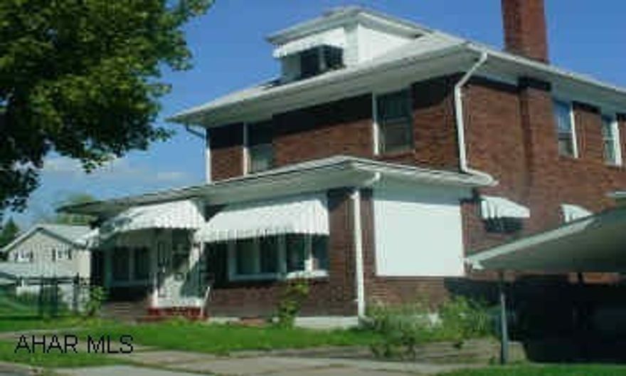 Classic brick home in Juniata with hardwood floors, natural woodwork, modernized kitchen and bath and so much more!