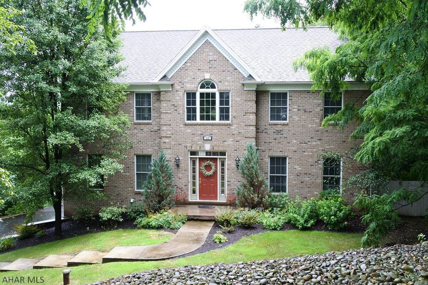 H-burg Las Villas. Stately 2 story boasting 4 Brs, 3.5 Baths and a finished walk out lower level. 1st floor consists of a LR, DR, spacious kitchen with rich granite counter tops, an island and SS appliances. Cozy up to the FP in the adjacent FR or step outside onto the over sized deck, perfect for those warm Summer nights. There's a first floor office and, for convenience, a laundry too!  Upstairs, use the loft area for a reading nook or computer area for kids. Owners' suite has a generously sized bath, jetted tub, his and her sinks and closets.  The exterior will not disappointthere's a private, professionally landscaped and hardscaped, rear yard, a covered patio area, a separate carriage house type garage, in addition to the integral 2 car garage.  Close to schools, shopping + highways.