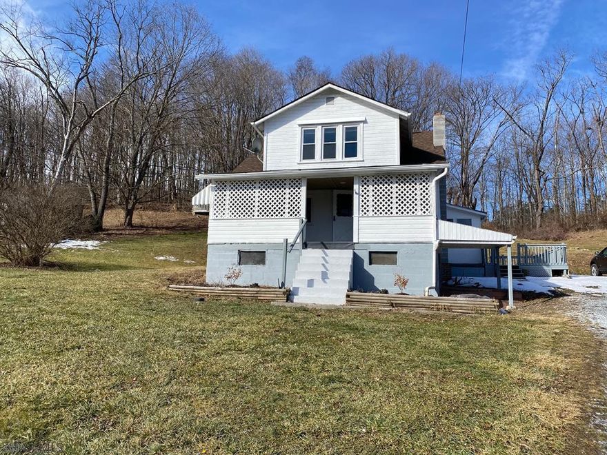 Cape cod home with fresh paint, new kitchen cabinets and original wood floors. Three bedroom, one and half bath with laundry on main level. Two car garage with electric and work area.