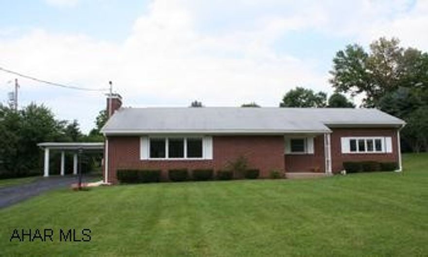 Brick ranch with white shutters, located in Meadowbrook Terraace. Brick ranch with wihte shutters. Located in Meadowbrook Terrace, an ideal residential neighborhood. 2BR/1BA; spacious living room, dining room with Tiffany light. French Doors open to light and airy sunroom. Laundry area on main level, hardwood floors. Full basement recently painted with new lighting; has fireplace; could easily be finished as family room. 21'x25' 2-car carport. Large yard.