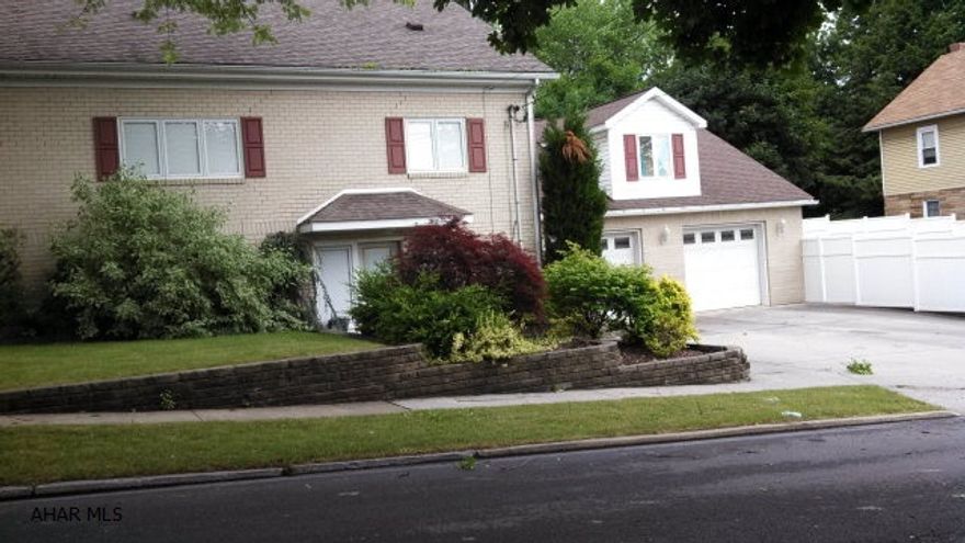 kitchen has solid oak cabinets and ceramic tile floor with radiant heat .. open floor plan.. lots of room, huge garage    fenced lot with patio   heated driveway