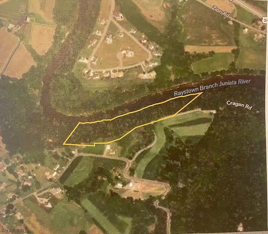 This wooded, 10.13 ac parcel sits elongated on Cragan Road with panoramic views in the Fall of the Appalachian Mountains and the winding Juniata River. Enjoy 900' of water frontage for fishing or canoeing. Steep cliff side hides many wildlife and provides great hunting. At the top of the parcel is room for building a cabin and parking. An old cabin already on the property is worn down and uninhabitable, but provides a foundation for a future build. Quiet and peaceful, this is desirable for any outdoor enthusiast.