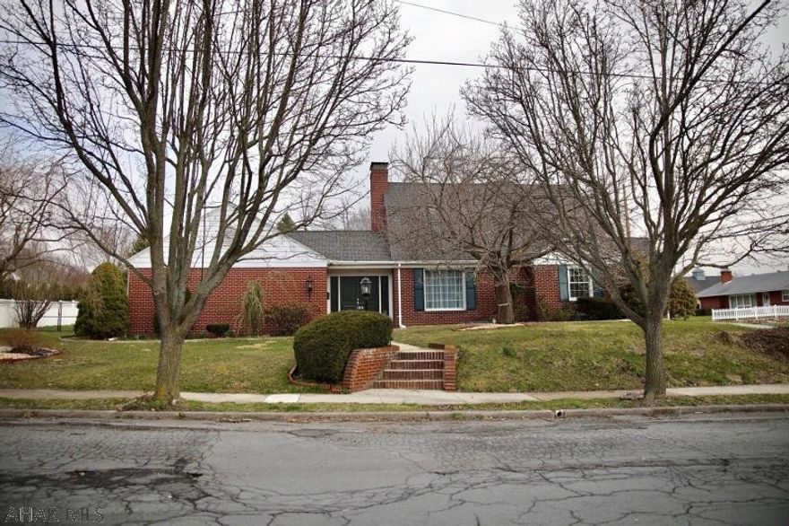 Massive curb appeal comes with this brick cape cod home. Double door entry with nice foyer, huge master suite with full bath, walk in closets with door leading to back patio. Large living room with inviting wood fireplace, formal dining room. Huge sunroom in back off the kitchen leads to a flat newly vinyl fenced yard. Perfect for fun and privacy. Half bath completes main floor. Two nice size bedrooms and full bath on 2nd level. Finished basement family room for additional living space. One car attached garage, natural gas heat with central air. In town location!