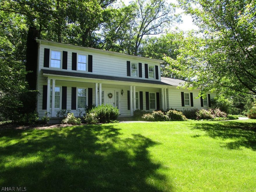 Location, location, location!! This quality built home is situated directly across from the Omni Bedford Springs Golf Course. Resting on a double lot that is open and wooded with 2.19 acres. The main level offers offers a foyer, large living room with a wood fireplace, formal dining room, kitchen with dining area and picture window, family room with brick fireplace and wood burner, laundry room and half bath. Second level has a large master suite with walk-in closet and master bath, two additional bedrooms and another full bath.  Hardwood floors on second level, crown moldings, heat pump with central air conditioning and a full basement. Relax on the front covered porch or entertain on the rear concrete patio bordered by a stacked stone wall. Two-car attached garage and macadam driveway.