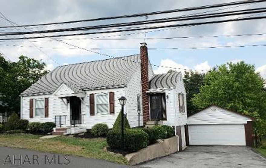 3-bedroom vinyl-sided cape cod with eat-in kitchen & dining room, newer central air, nice back yard, covered patio, blacktop drive & 2-car detached garage on .3Ac lot.  J-515