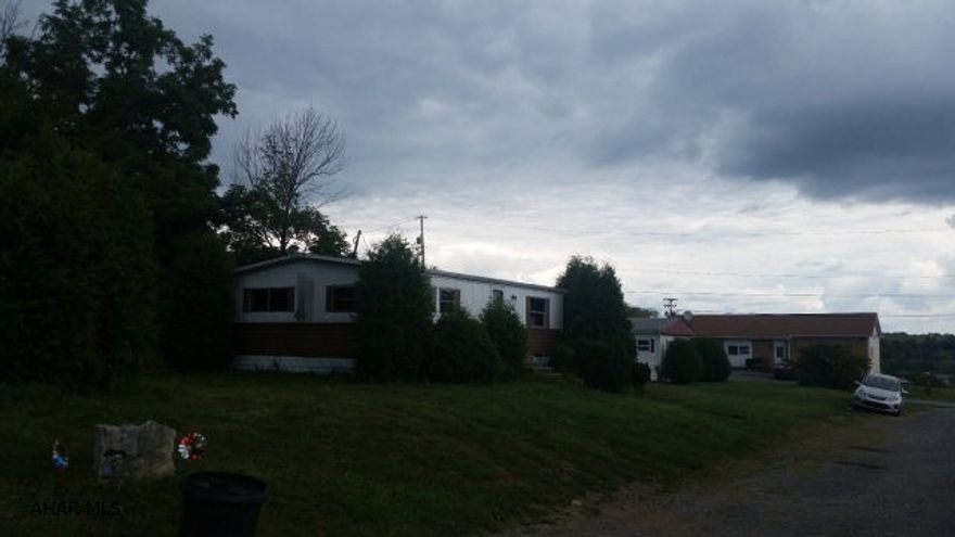 Great investment  5 MH, garage & vacant lot...current rental income is $1590.00 per month.*could change* All mobile homes are in the 70's