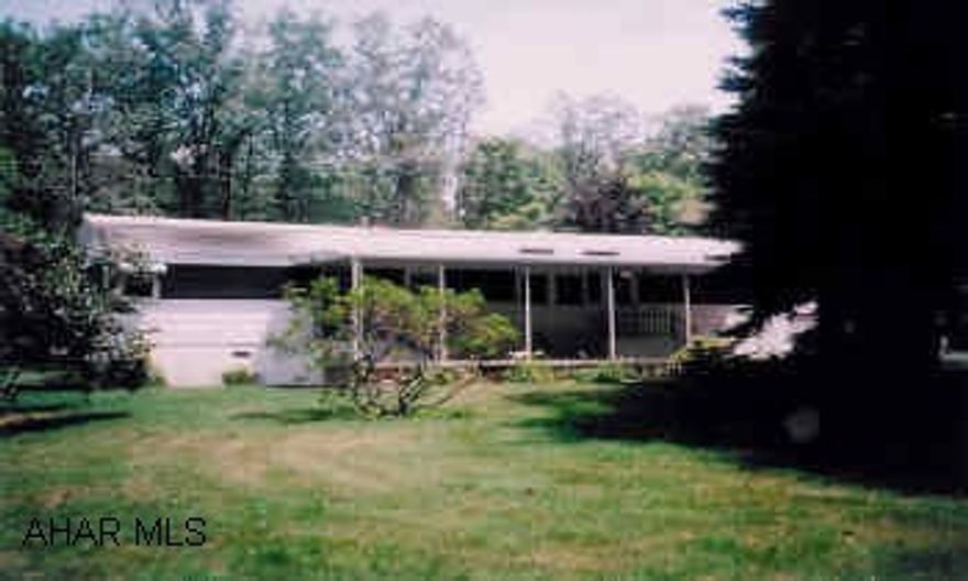 12x60 Holly Park Mobile Home with 15'x18' addition. Detached 32'x28' garage with finished 2nd floor. 24'x40' RV Garage and 14'x18' shed. Breezewood Park Restrictions apply.Three (3) TVs are no longer included in sale.