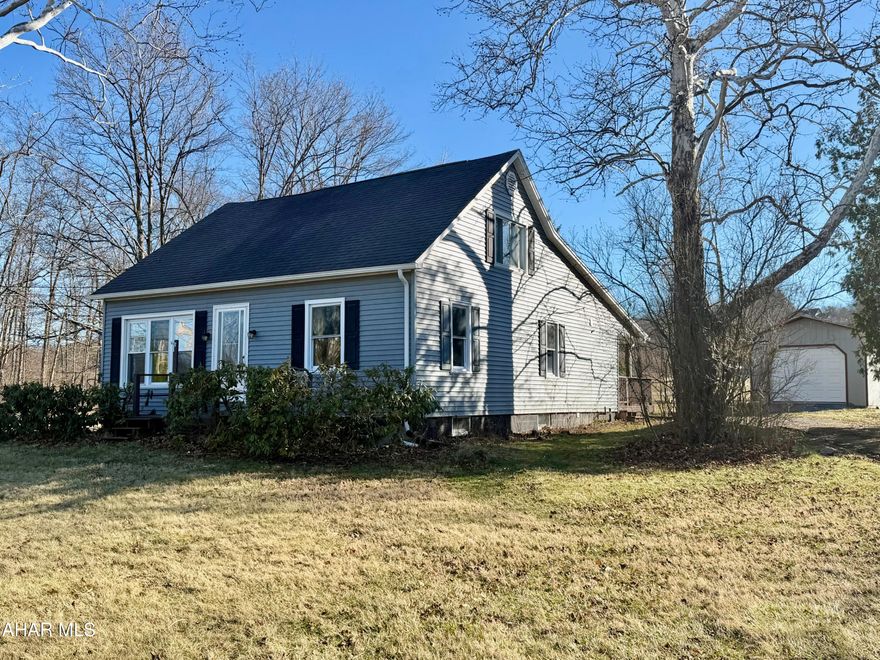 Recently renovated, this 3 bedroom, 2 bath Cape Cod offers 1,730 square feet of living space situated on a spacious 1.438 acre lot in the Chestnut Ridge School District. The kitchen includes hickory cabinets, Hanstone Quartz counters, undermount stainless sink and all appliances included.  Main floor also includes 2 bedrooms, 2 fully updated bathrooms, living room mudroom/foyer and laundry.  Upstairs you will find a spacious third bedroom along with a large flex room that adds options for additional living or bed space to fit your family's needs.  The home also includes a full unfinished basement for storage, an integral garage, and a detached 32' × 14' storage building that offers plenty of room for tools, equipment, or a side by side.  Outdoors the home has a nice sized, partially covered 16' x 12' deck over looking the back yard.  Just .5 miles from I-99 this property provides easy access to Bedford, Altoona, Johnstown or the PA Turnpike and US route 30.  Give us a call today to make this house your new home!