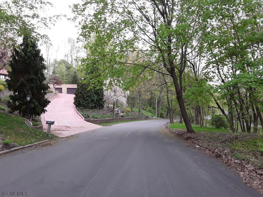 Excellent Wooded Building Lot near Baker School in Established Neighborhood. Utilities at the Street. Great Spot for the Home You Have Always Wanted. Agent Owned.