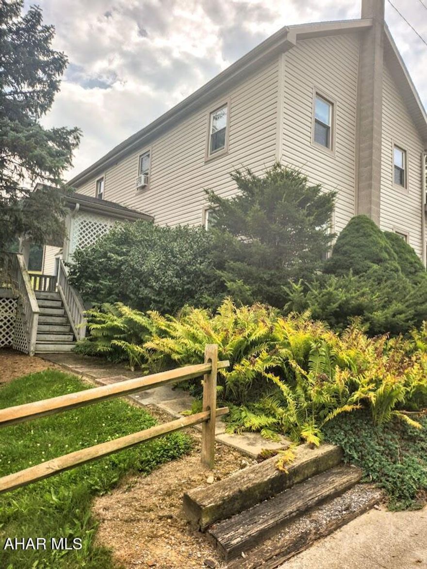 Set on 2.18 acres and bordered by farms, cornfields, and woods, this 2,728 sq ft, 3 bed/2 bath home blends space, character, and utility. The living room's wood-beamed ceiling sets a cozy, rustic tone, and the oversized primary bedroom offers the same handsome exposed beams plus ample space for a reading nook or home office. Multiple outbuildings and garages provide storage and workshop options, while the level yard is ideal for play, gardening, or gatherings. Peaceful country living with room to spread out.