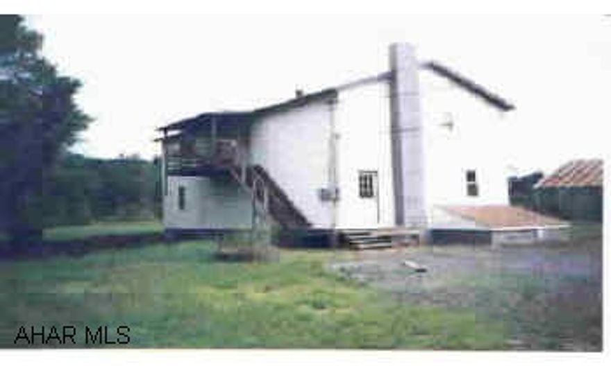 3 Unit Apartment with 1 two BR and 2 one BR units.  Storage Room, Full basement with extra high garage door. 29 acres with some road frontage along Rt. 30. Across from Shawnee State Park Entrance. 3 Unit Apartment with 1 two BR and 2 one BR units.  Storage Room, Full basement with extra high garage door. 29 acres with some road frontage along Rt. 30. Across from Shawnee State Park Entrance.  Owner's Expense: Electricity, Heating, Hot Water, Oil, Rubbish