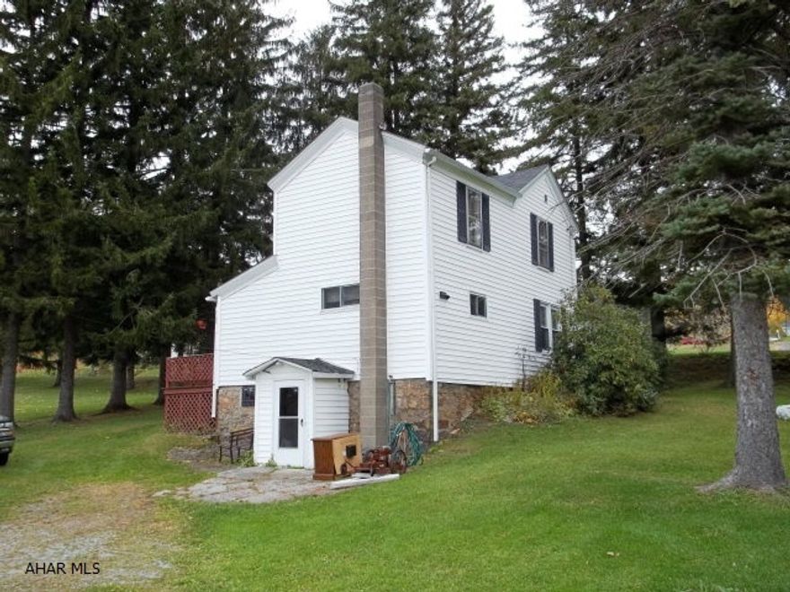 Beautiful views. Mostly flat. 3+ acres. Nice three bedroom 1.5 bath farmhouse.This property should should qualify for Rural Housing.  Great location for horses or livestock, flat with the majority of the property behind the house.  This would allow for more available pasture CITY WATER - CITY SEWERThis would also be a great hunting camp - 2 miles from State Game Lands and a branch of rails to trails.