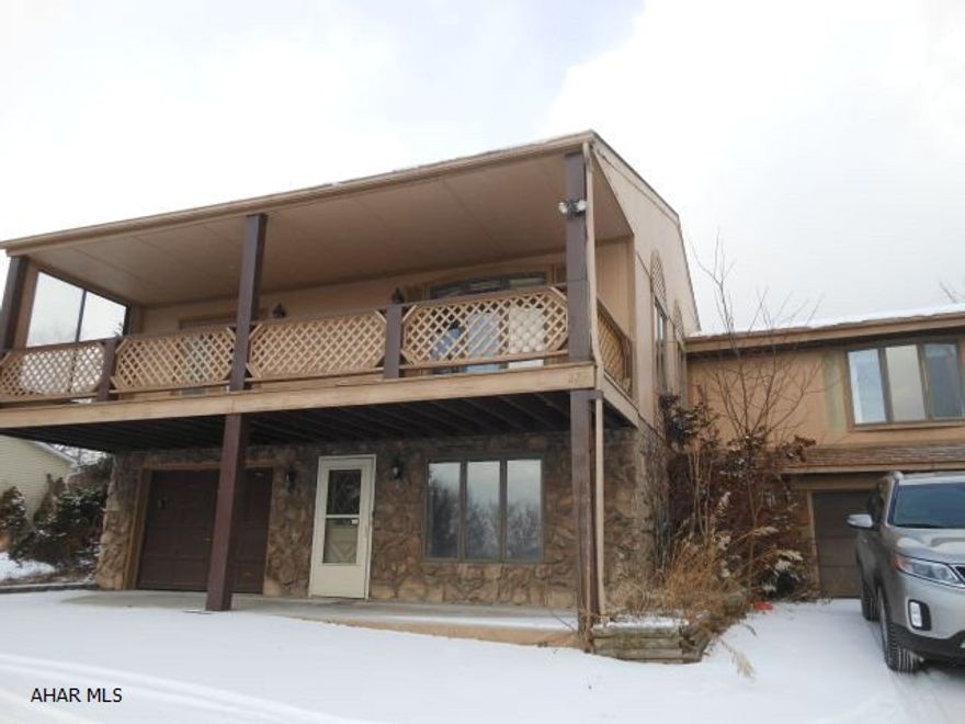 This is a raised ranch home with an attached 2 car garage. The basement can be finished to make it your own. The main floor features a kitchen, full bath, three bedrooms including a master bedroom and bath. This home has potential.