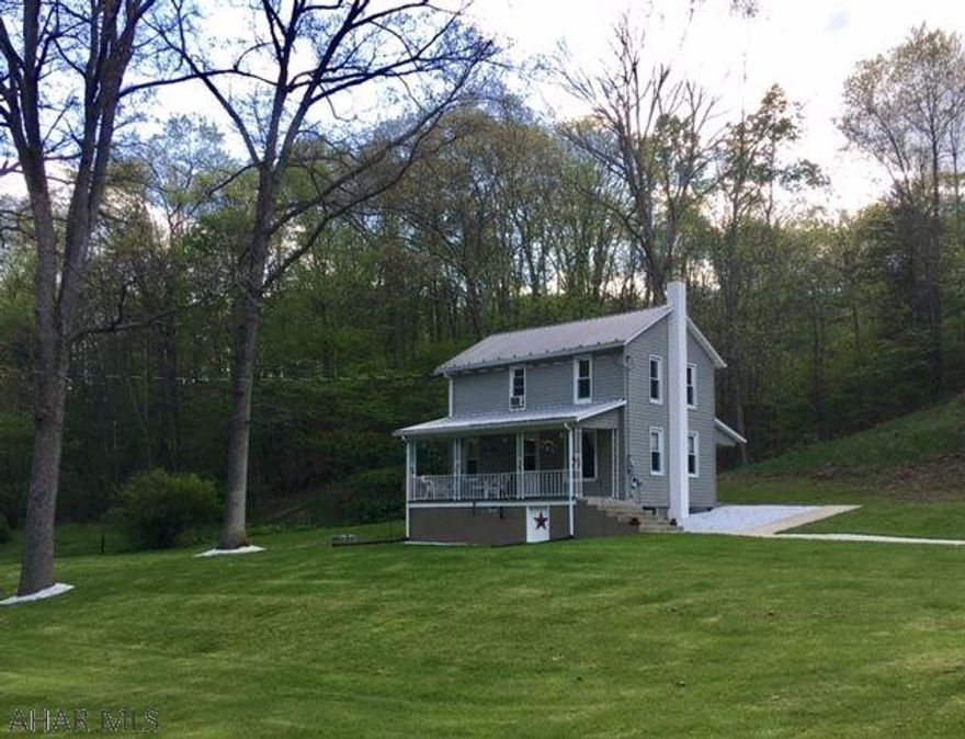 Serene country setting with over 3 acres, 2 bedrooms, 1 and 1/2 bath home, large garage, and shed. Inviting front porch to relax and enjoy the peace and quiet. Move in ready!