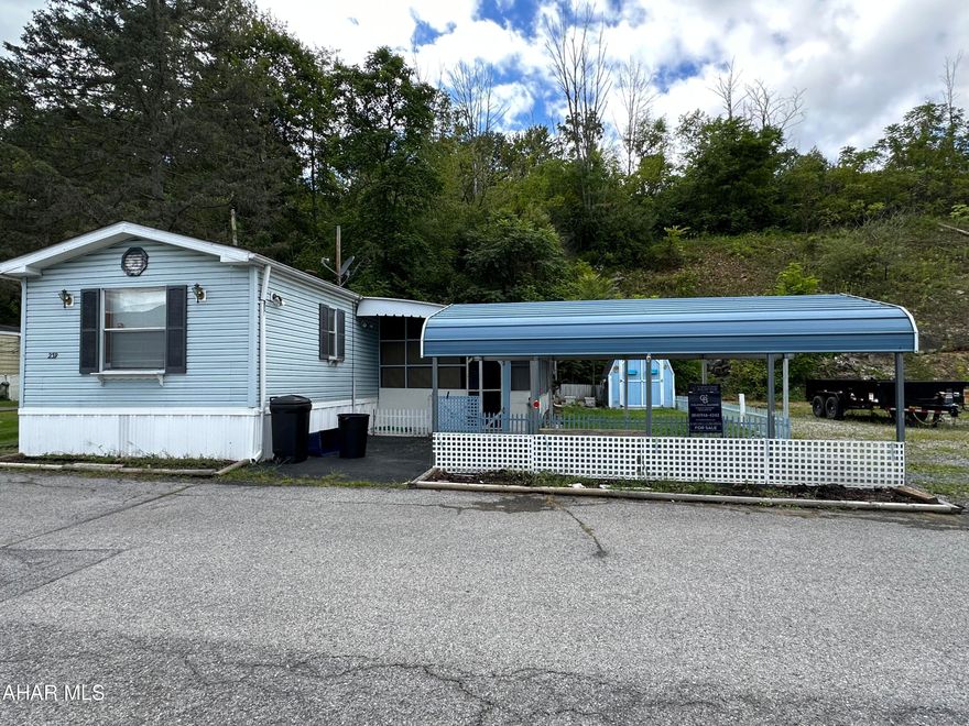 Conveniently located single wide in the Greenwood section of Altoona. Spacious kitchen with appliances included. Central air. Two sheds. A metal carport to protect your vehicle from the elements. Screened in sun porch. Partially fenced yard.  Lot rent $340/month includes water/sewer & lawn maintenance. Applications to be submitted for lot approval.
