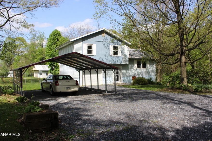 Welcome to 127 Tremmel Lane.  With New Flooring just put in the Family Room.  This property is conveniently located in Roaring Spring, with access to Altoona or Bedford in minutes.  It features a Very Nice Country Setting.  The Spacious Fenced-In Back Yard and Covered Porch, no doubt, will be your ''Favorite Oasis'' to sit and Enjoy this Summer !!!
