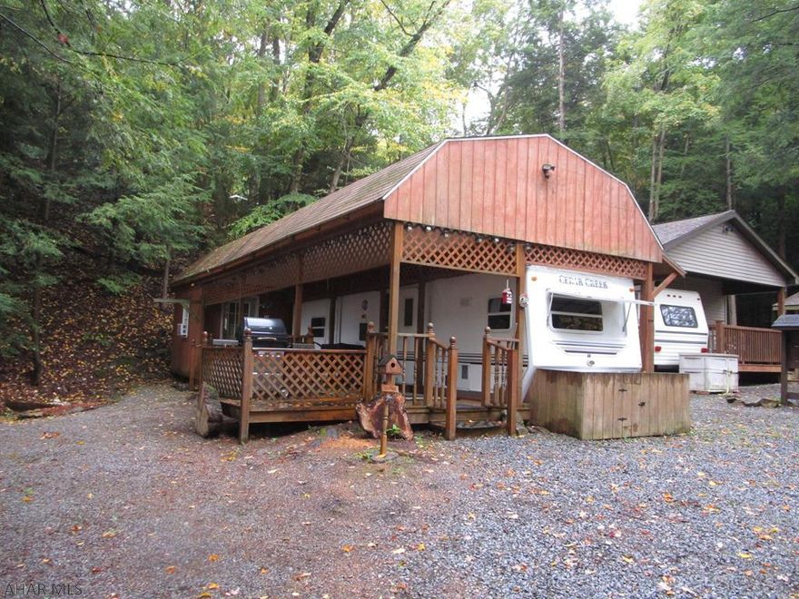 Camping is all about the outdoors and this property gives you plenty of outdoor space and privacy.  Two adjacent campsites with fire pit area, shed and camper with addition and covered deck.  Sleeping space for the whole gang, each with their own privacy.  Even in the rain you can sit on the deck and enjoy the view.  Located in Glendale Yearound, a gated recreational community adjacent to Prince Gallitzin State Park / Glendale Lake.  Six miles from Rock Run ATV Park.