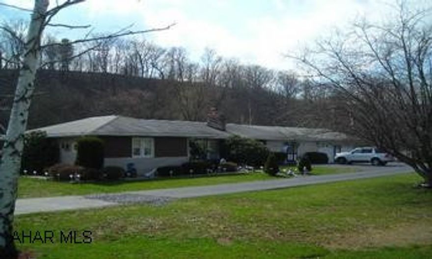 Sprawling ranch that has been lovingly maintained on 4+ acres! This large ranch has been lovingly maintained and offers 1600+ square feet, 3 bedrooms, 1.5 bath, office, large laundry room, eat-in kitchen, spacious livingroom with fireplace, rec room, screened-in porch, attached 2 car garage!  Terrific setting with Yellowcreek in backyard!  This is a must see home! AGENTS- call Tina to show at 814.242.2047 OR 814.623-3295;5% total commission with reciprocal split first 30 days and 6% total commission thereafter with reciprocal split.