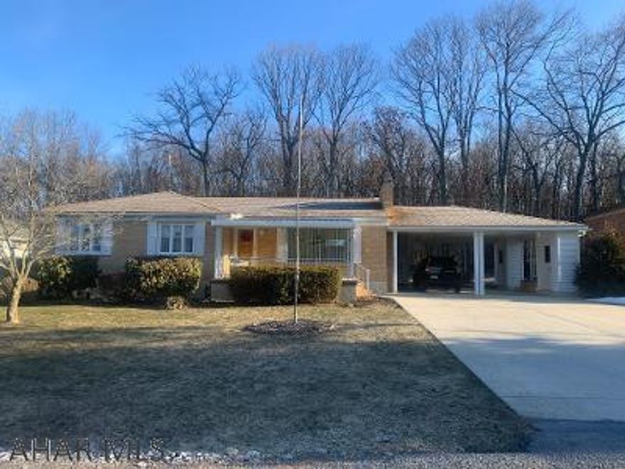3 bedroom, hardwood floors, 2-car carport