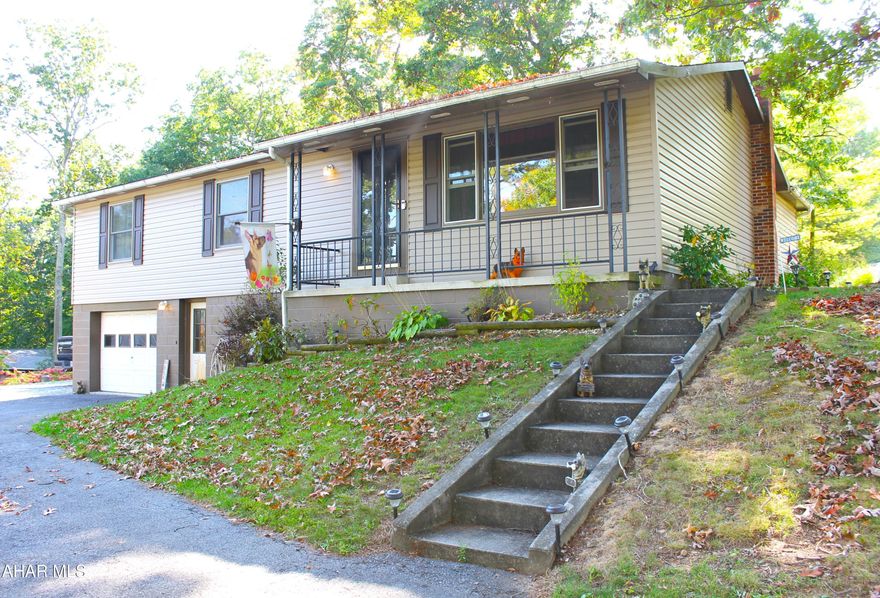 If you're looking for a move in ready home with all the features you could possibly need, this is the one for you!!!  This charming ranch home sits on a corner lot and is located just outside of Everett Boro, where you will love the convenience of being just minutes from town.  Pulling in, you will appreciate the ease of the paved circle driveway, extra parking for your camper or ATV and the warm appearance of the newer siding.  Upon entering, you will find a large living room that is open to the dining room and is just waiting for you to entertain guests.  The kitchen provides a nice flow while featuring a breakfast bar, tons of cupboard space and a large pantry.  Off the dining room, you will love the bonus space created by the enclosed porch that would be perfect for use as a mudroom, pet room, office or even an extension of your outdoor space.  Explore the outside when you open the doors that lead to the huge patio, and you will find the perfect place to spend relaxing evenings under the shade trees and the gated partially fenced yard will give you peace of mind that your 4-legged family or little ones are safe.  The main floor also features 3 spacious bedrooms with ample closet space, an updated hall bath and a full bath in the primary.  Down the basement steps, you will be pleased to see two large open rooms complete with a real wood burner where you can spend cozy nights cuddling by the fire.  Let your imagination run wild as you dream of what the finished basement area could be used for, a family room, game room, exercise area or maybe even a 4th bedroom are just some of the possibilities.  And no need to worry where to put those family photos or décor because you'll have plenty of space to fill with the large built-ins, and the little cubbies in the hallway provide the perfect spot for hanging coats, bookbags or purses.  The basement foyer features coat hooks, bench and cabinet storage and a separate room with shelving to keep those seasonal items or holiday decorations.  In the laundry room you will find a third full bathroom as well as the included washer and dryer.  The garage gives you the added convenience of a pet tub to keep your fur babies clean and smelling good as well as plenty of room to park on those cold winter nights.  The summer becomes beautiful outside, as this home is landscaped with rose bushes, hostas, hydrangeas and more that bloom every year.  The 10 x 12 shed provides ample space to put your lawn mower and gardening equipment, while the 12x24 shed provides you extra storage or a workshop for those projects you've been wanting to tackle.  Other property features include central air and ceiling fans in each bedroom just to name a few.  So, if you think this is the home you've been waiting for, call today and schedule your showing before it's gone!