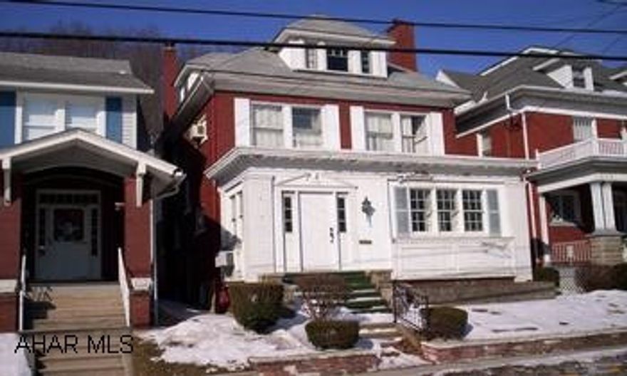 Large brick home in Tyrone.  3 to 5 bedrooms.  Finished basement.Electric service needs updated. Large brick home with hardwood floors on first and second floor.  2 heated finished rooms on 3rd floor.  Beamed ceilings, knotty pine panelling, closed front porch and finished basement.  Needs TLC.Electric service needs updated.