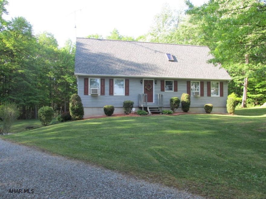 Well maintained 3 Bedroom 3 Bath Cape Cod. Open Kitchen, Dining, Living Room Floor Plan with Cathedral Ceilings, New carpet, New roof, Ceramic floors in both baths, Master Bath has a jacuzzi tub. Trough Creek and State Gamelands directly behind property. MUST SEE!!! Minutes away from Raystown Resort.