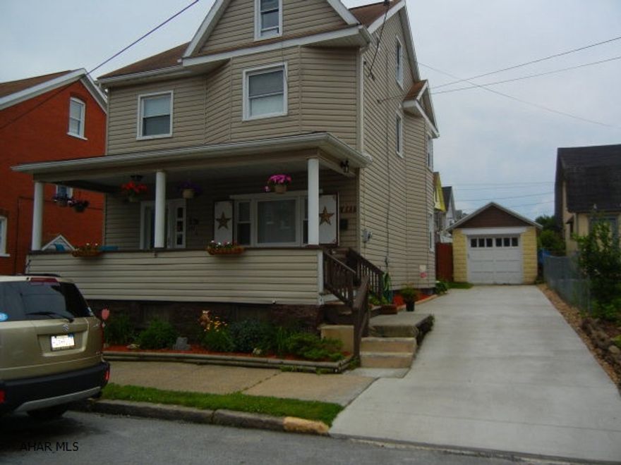 Nicely updated home with private backyard.  Newly fenced area for small children or pets off covered back porch.  Remodeled kitchen allows easy access to formal dining room.  New concrete driveway to garage at rear of property.  Open front porch.  Finished third floor for additional bedroom, office or children's playroom.  Many newly replaced windows throughout.  HOME WARRANTY INCLUDED.