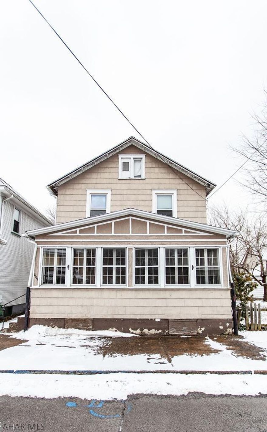 4 bedroom, 2 bath house with fenced in yard and enclosed front porch.