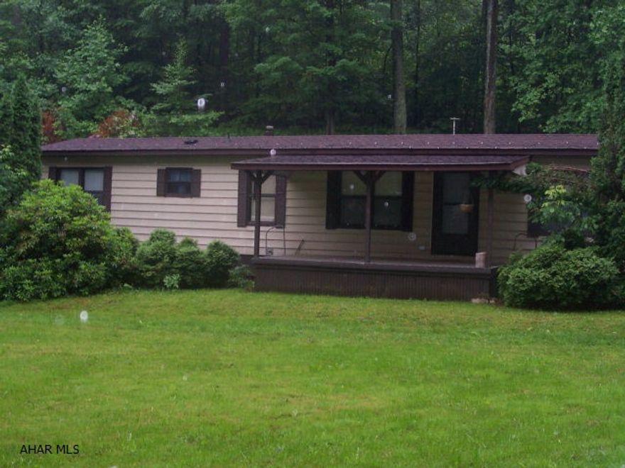 Move-In Condition, 2 Bedrooms, 1 Bath, 14 X 70 Singlewide, With New Carpet, Newer Roof And Hot Water Tank, Covered Porch, Sun Room Addition In Back With Outside Hot Tub, And All Appliances Included.